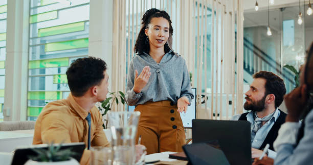istock Business people, discussion and paperwork for collaboration, planning or brainstorming in office. Creative, employees and team meeting with tablet technology, documents and project management 2185334270
