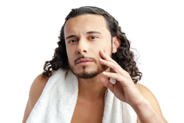 istock Smiling man with curly hair showing confidence while holding a towel 2185334332