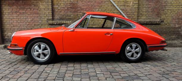 Speyer, Germany – September 15, 2024: A classic red Porsche 901 parked on a cobblestone road