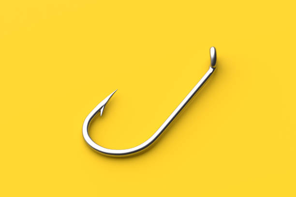 Fishing concept. Shiny metallic fish hook on yellow colored background. Its sharpness and close up detail catching the eye. 3d render.