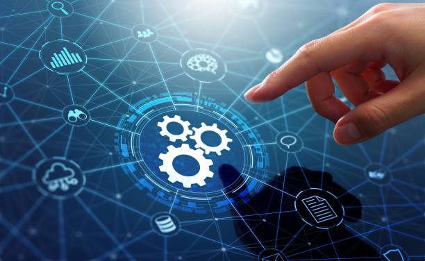 Automation of business or robotic process RPA technology. Transfer of data between application. Businessman touching gears icon on network connection. it services stock pictures, royalty-free photos & images