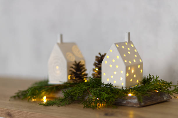 istock Winter and christmas decoration with small illuminated houses 2185338853