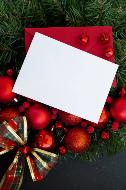 istock Copy space mock up template white paper sheet on postcard with envelope on handmade Christmas wreath. Zero waste eco-friendly Christmas. Sustainable greeting card 2185339456
