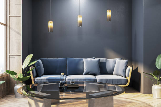 istock Modern living room with blue sofa, glass coffee table, and natural light from large window, cozy minimalist design. 3D Rendering 2185341240