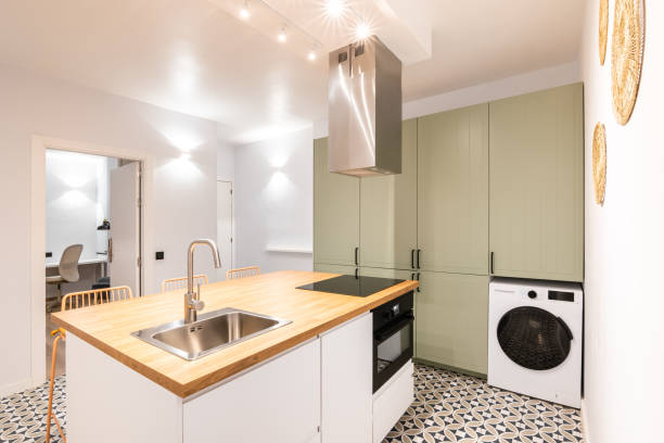 istock Kitchen in modern design is equipped with necessary appliances and furniture to use usable space of apartment. Luxurious kitchen for cooking and comfortable pastime with family and friends. 2185342168