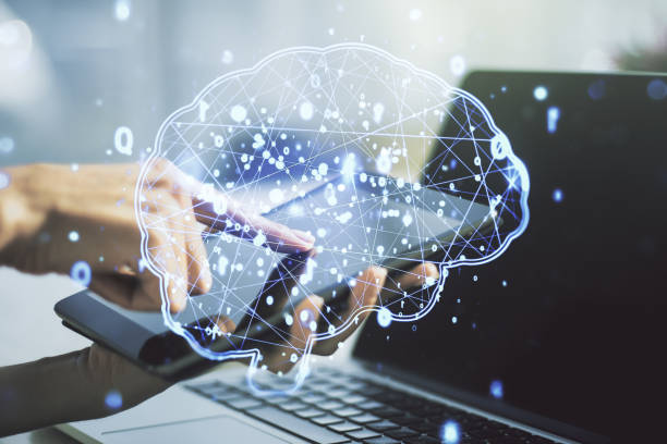 istock Creative artificial Intelligence concept with human brain sketch and finger presses on a digital tablet on background. Double exposure 2185344983