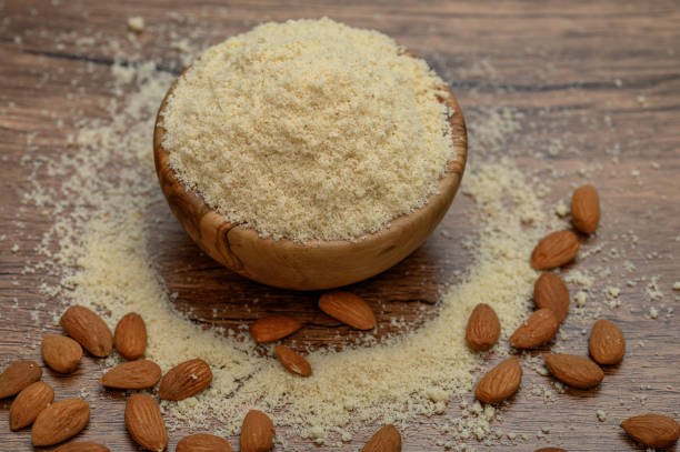 istock Ground almond flour on the table, isolated macro 2185345429