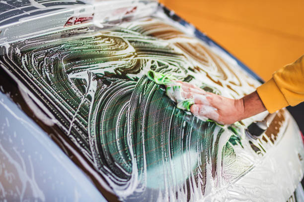 istock Close-Up of Car Being Washed With Soapy Water By Hand 2185345912