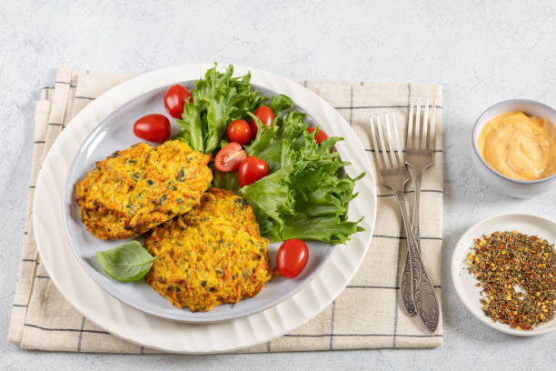 istock pumpkin carrot potato patties on plate, top view 2185347366