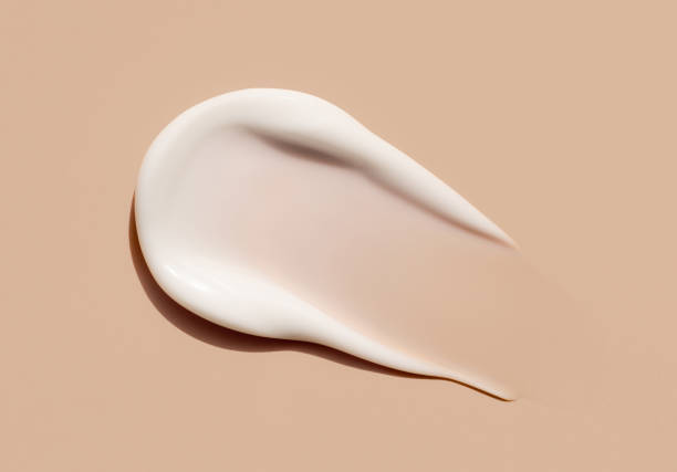istock cosmetic smear cream texture on beige background 2185347438