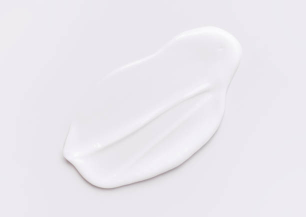 istock creamy smear of white cosmetic texture on gray background 2185347439