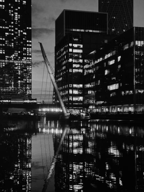 istock Cityscape of illuminated buildings and reflections at dusk. 2185347903