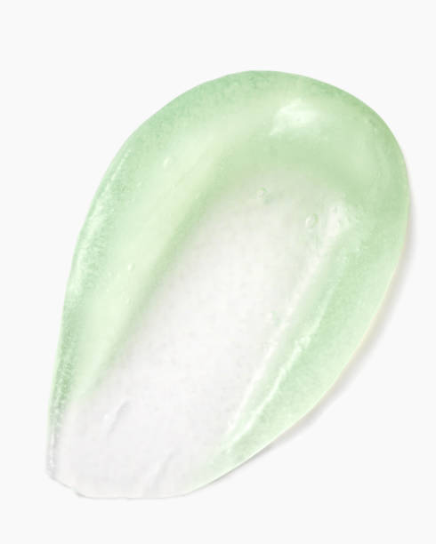 istock Green scrub swatch with visible particles on a white background, highlighting texture and detail 2185349516