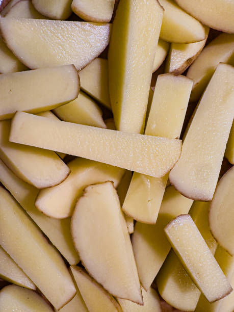 istock Close up raw uncooked potatoes chips or fries 2185350857