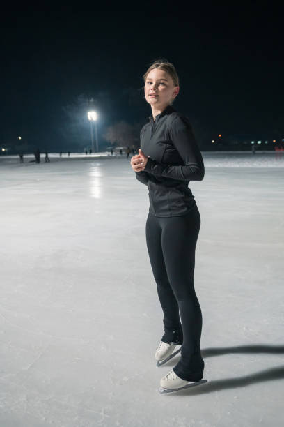 istock A devoted professional figure skater diligently trains on the ice during the night hours 2185357387