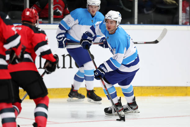 istock Ice Hockey Players Engaged in Strategic Play 2185357626