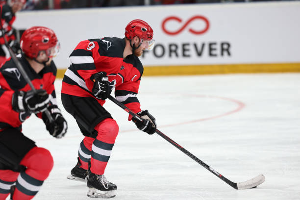 istock Focused Ice Hockey Player in Action 2185357653