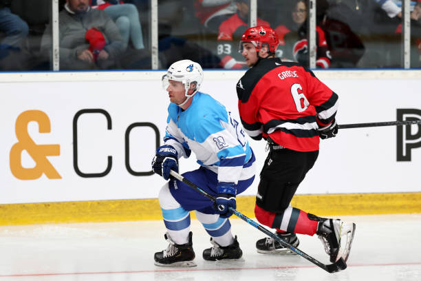 istock Ice Hockey Players in Action During a Competitive Game 2185357664