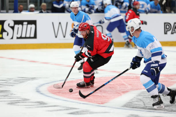 istock Ice Hockey Action: Red Team Player Maneuvering the Puck 2185357838