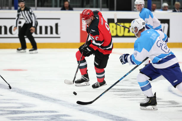 istock Intense Ice Hockey Play: Red Team Captain Takes Control 2185357843