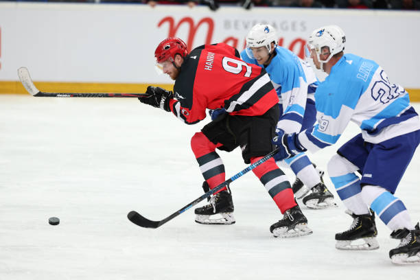 istock Ice Hockey Duel: Red Team Captain Leading the Charge 2185357855