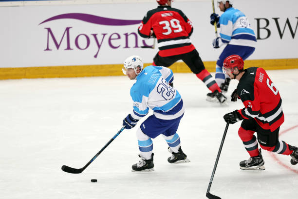 istock Ice Hockey Players Competing for the Puck 2185357938
