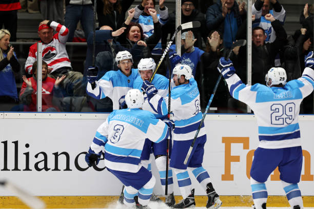 istock Ice Hockey Team Celebrating a Goal 2185358008