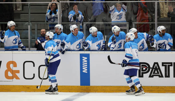 istock Ice hockey player giving high-five to teammates 2185358025