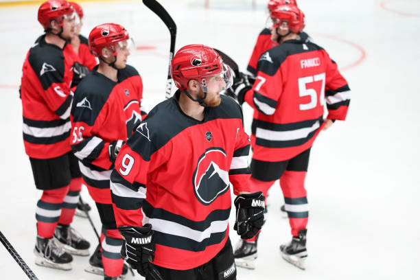 istock Ice Hockey Team in Red Jerseys Preparing on Ice 2185358054