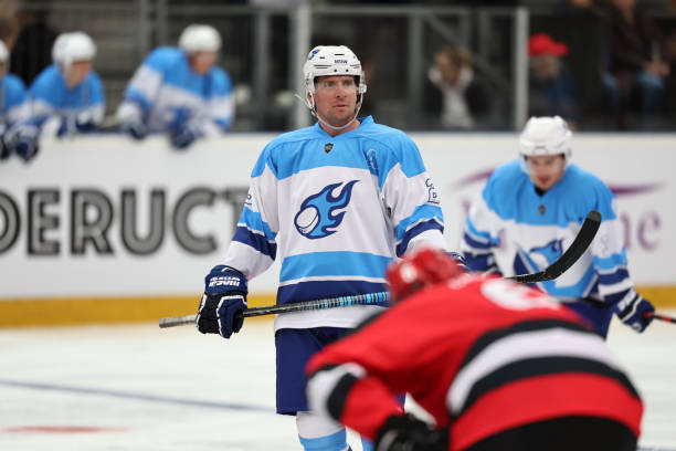 istock Focused Ice Hockey Player in Blue and White 2185358080