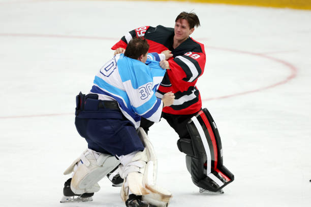 Intense Ice Hockey Goalie Fight Opponent team ice hockey goalkeepers fighting during match on ice rink. red hockey jersey stock pictures, royalty-free photos & images