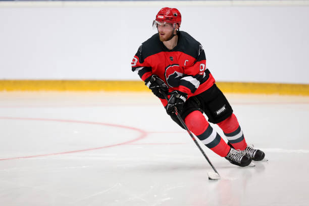 istock Focused Ice Hockey Player in Action, Controlling the Puck 2185358209