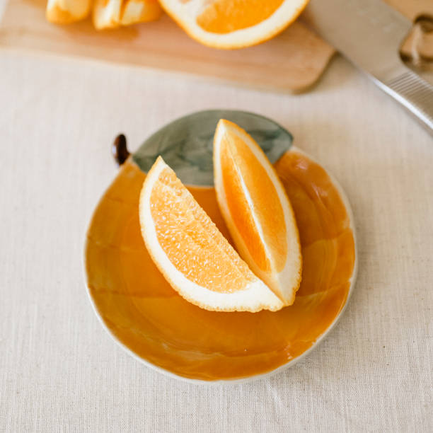 istock Orange slices on fruit plate simplicity of healthy eating 2185359235