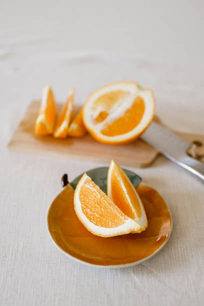 istock Orange slices on fruit plate simplicity of healthy eating 2185359272