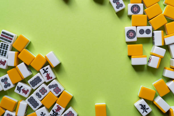 istock Mahjong tiles lined up on a green background 2185360119