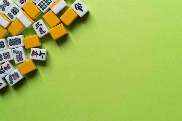 istock Mahjong tiles lined up on a green background 2185360146
