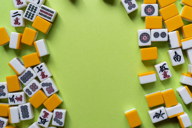 istock Mahjong tiles lined up on a green background 2185360154
