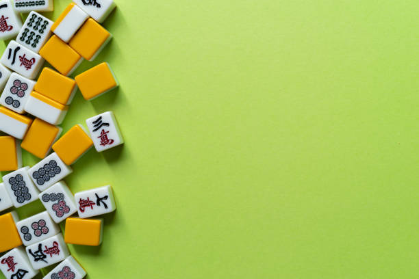 istock Mahjong tiles lined up on a green background 2185360161