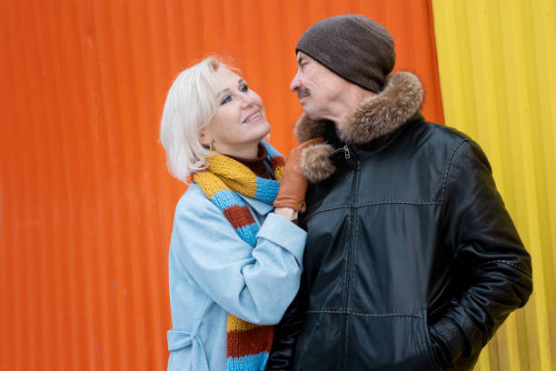istock Elderly couple sharing a tender moment on a colorful walk 2185360221
