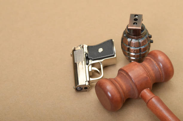 istock Judge Gavel, Gun, and Grenade: Symbolizing Justice, Power, and Conflict 2185361024