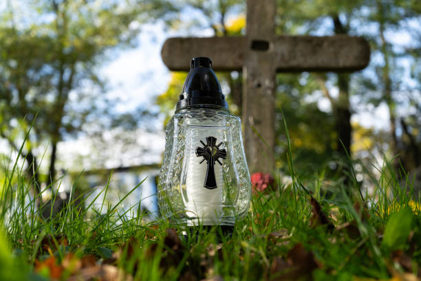 istock Cemetery grave candle glass lantern. All Souls Day. 2185364638