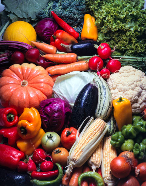 Group of large mixed fruits and vegetables on colorful background - High Resolution Image
