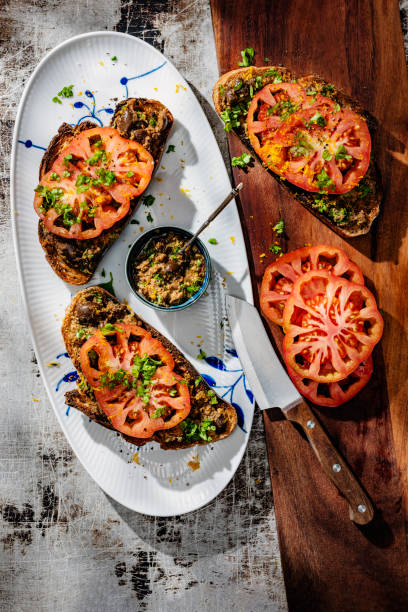 Beefsteak Tomatoes with Black Olive and Orange Tapenade