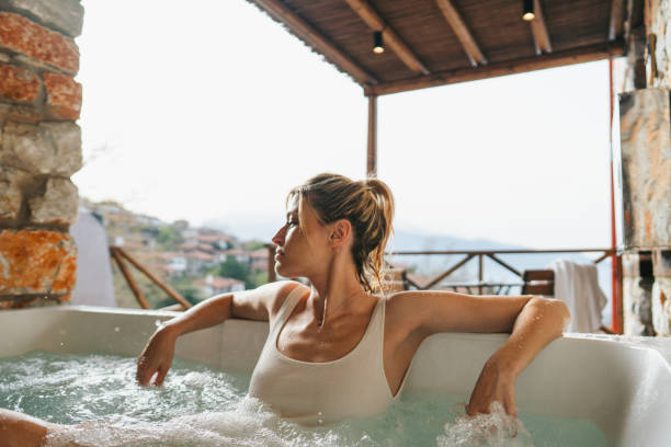 istock Woman in a hot tub 2185367918