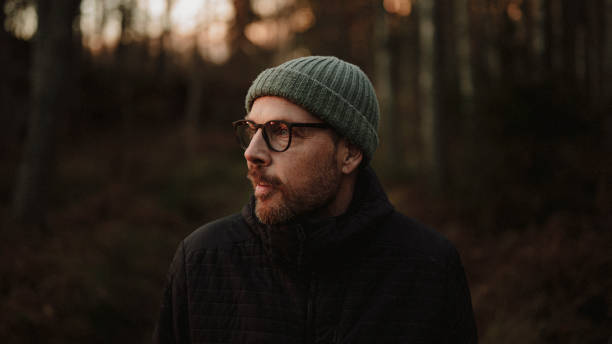 istock Man outdoors in forest at evening in winter 2185368109