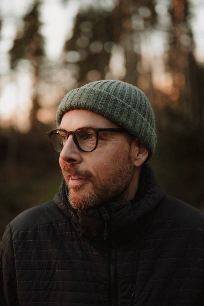 istock Man outdoors in forest at evening in winter 2185368151
