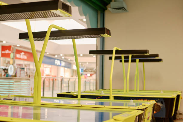 istock Electric lamps hanging over game tables 2185368326