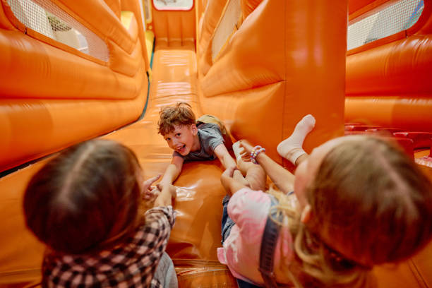 istock Girls trying not to let boy roll down 2185368462