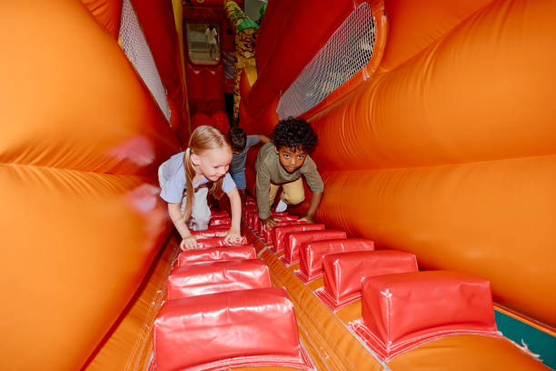 Cute friends moving to steep slide