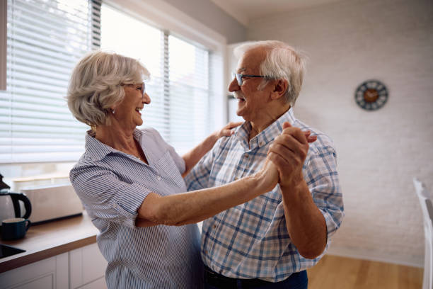 istock Happy senior couple dancing at home. 2185369024
